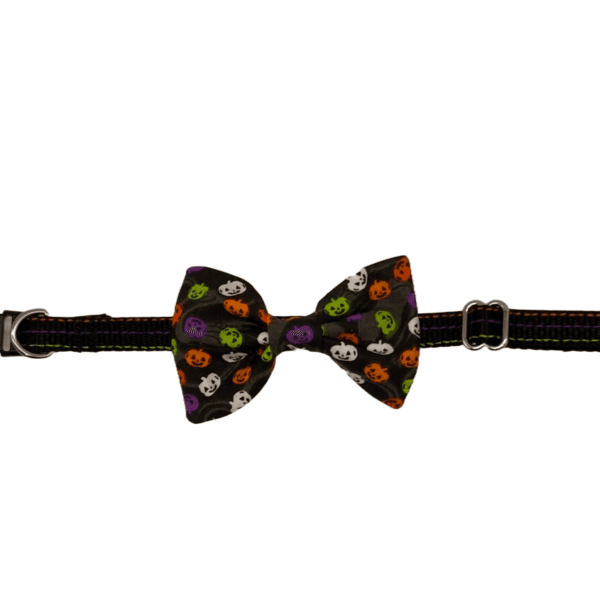 The Lined Halloween Pumpkins Adjustable Collar for little dogs or cats features a vibrant bow tie with pumpkin and ghost designs, complete with a secure buckle and loop for a snug fit.