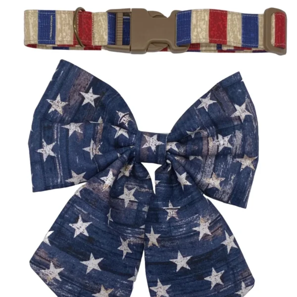 The Patriot Pup Dog Collar is styled with American flag patterns, featuring a collar with red, white, and blue stripes and a plastic buckle, plus a dark blue bow tie adorned with white stars.