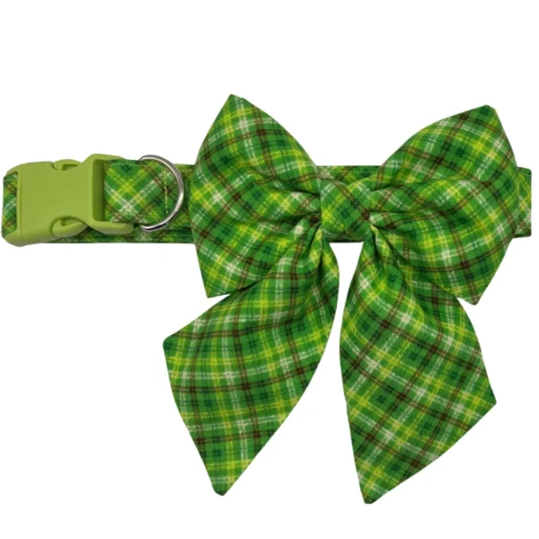 The Irish Plaid Sailor Bowtie Adjustable Dog Collar in green features a charming sailor bowtie, an adjustable buckle, and a sturdy metal ring for leash attachment.