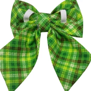 The Irish Plaid Sailor Bowtie for Little Dogs and Cats features a charming plaid pattern in green, yellow, white, and brown stripes, with long pointed tails and looped design secured by a white elastic band.