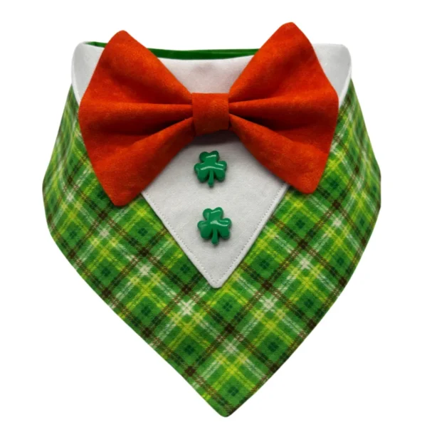 The Lucky Leprechaun Tuxedo Bandana showcases a green plaid pattern with a white upper section, bright orange bow tie, and two green shamrock buttons for added charm.