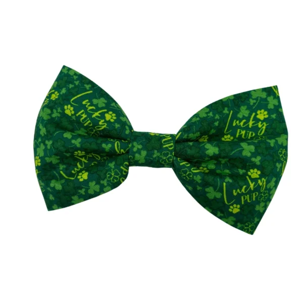 The Lucky Pup Doggy Bowtie is green with shamrocks, Lucky Pup in yellow, and playful paw prints for added charm.