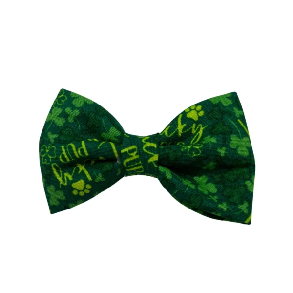 The Lucky Pup Bowtie for Little Dogs or Cats is a green accessory with vibrant four-leaf clover patterns and paw prints, featuring phrases in yellow-green for a festive flair, ideal for St. Patricks Day.